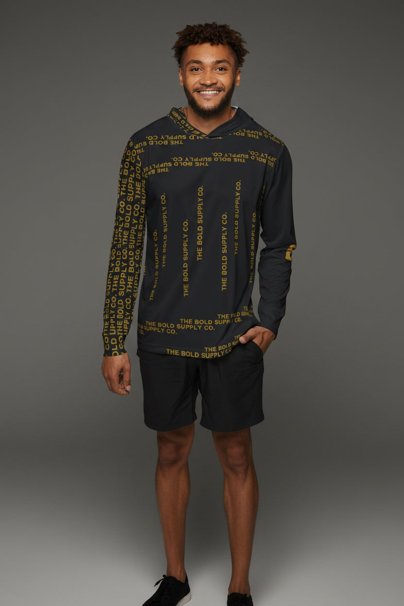 Man wearing a black long-sleeve shirt with yellow text and black shorts on a white background