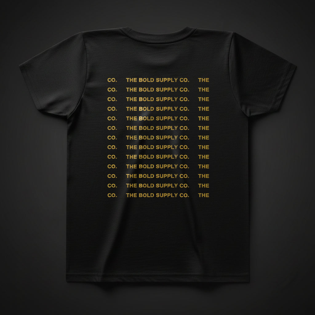 Black t-shirt with yellow text 'THE BOLD SUPPLY CO.' repeated multiple times on a white background