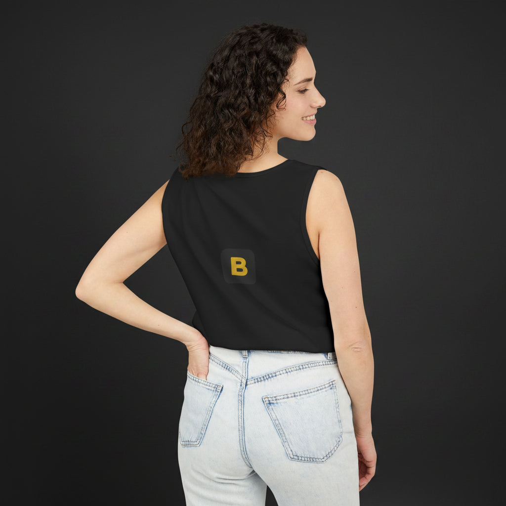 Woman wearing a black sleeveless top with text, standing against a white background