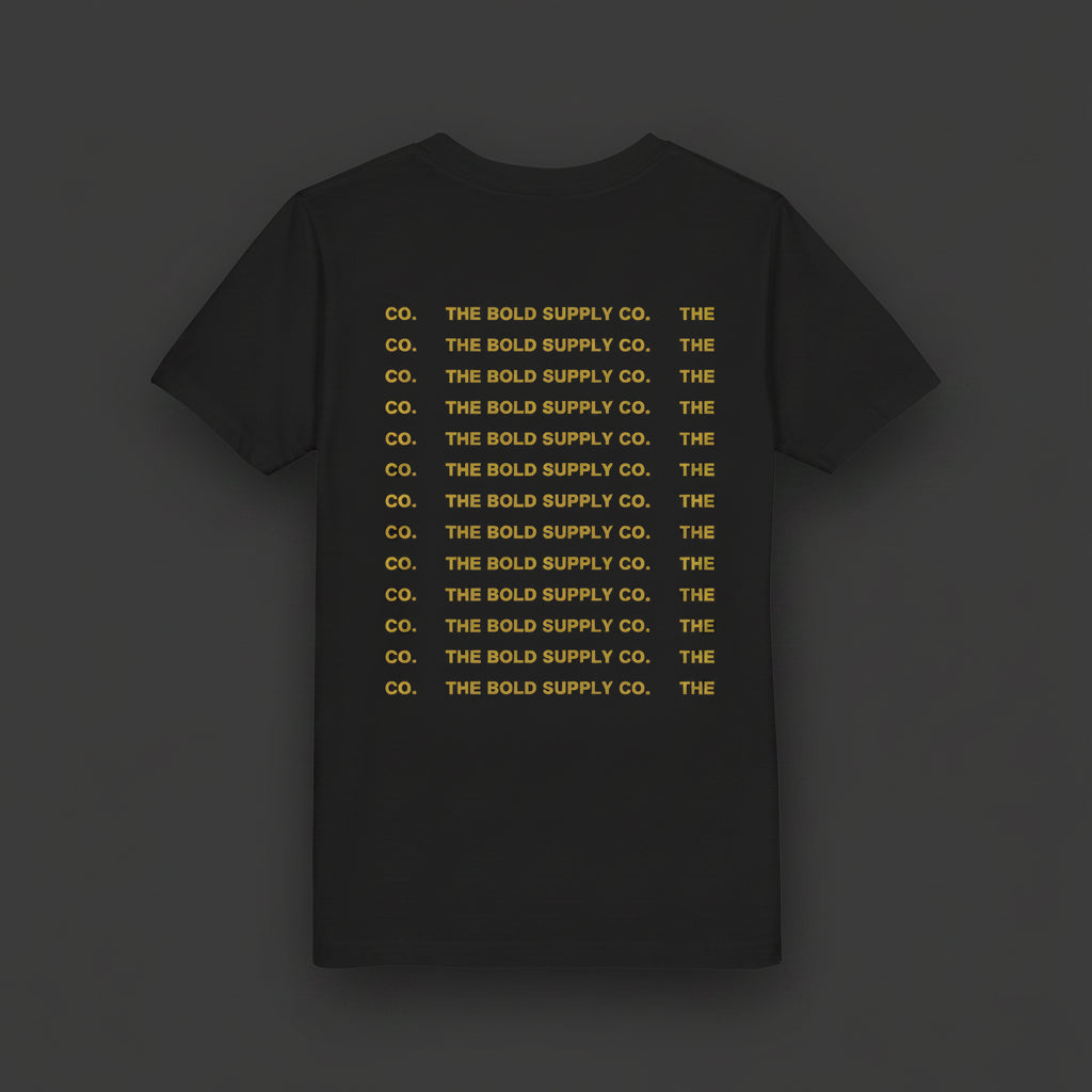 Black t-shirt with yellow text 'THE BOLD SUPPLY CO.' repeated multiple times on a white background