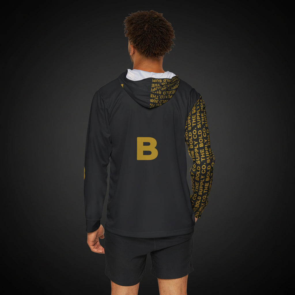Person wearing a black hoodie with gold letter 'B' and text, and black shorts on a white background