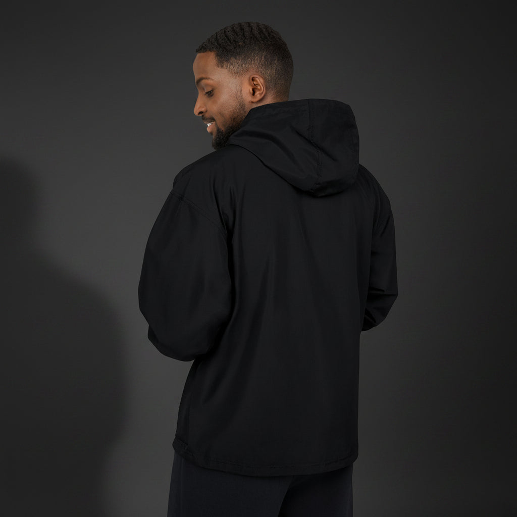 Person wearing a black hoodie from behind on a white background