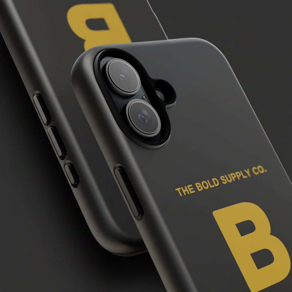 Black phone case with gold 'B' and 'THE BOLD SUPPLY CO.' text on a white background
