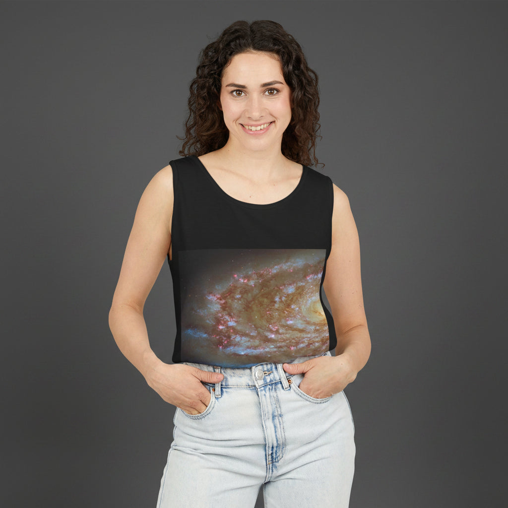 Woman wearing a black sleeveless top with a galaxy print on a white background