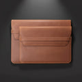 Brown leather laptop sleeve on a white background