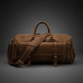 Brown leather duffel bag with multiple zippers on a white background